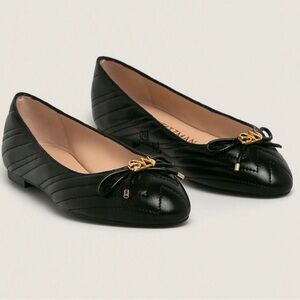 Stuart Weitzman Black Quilted Flats with Gold Detail